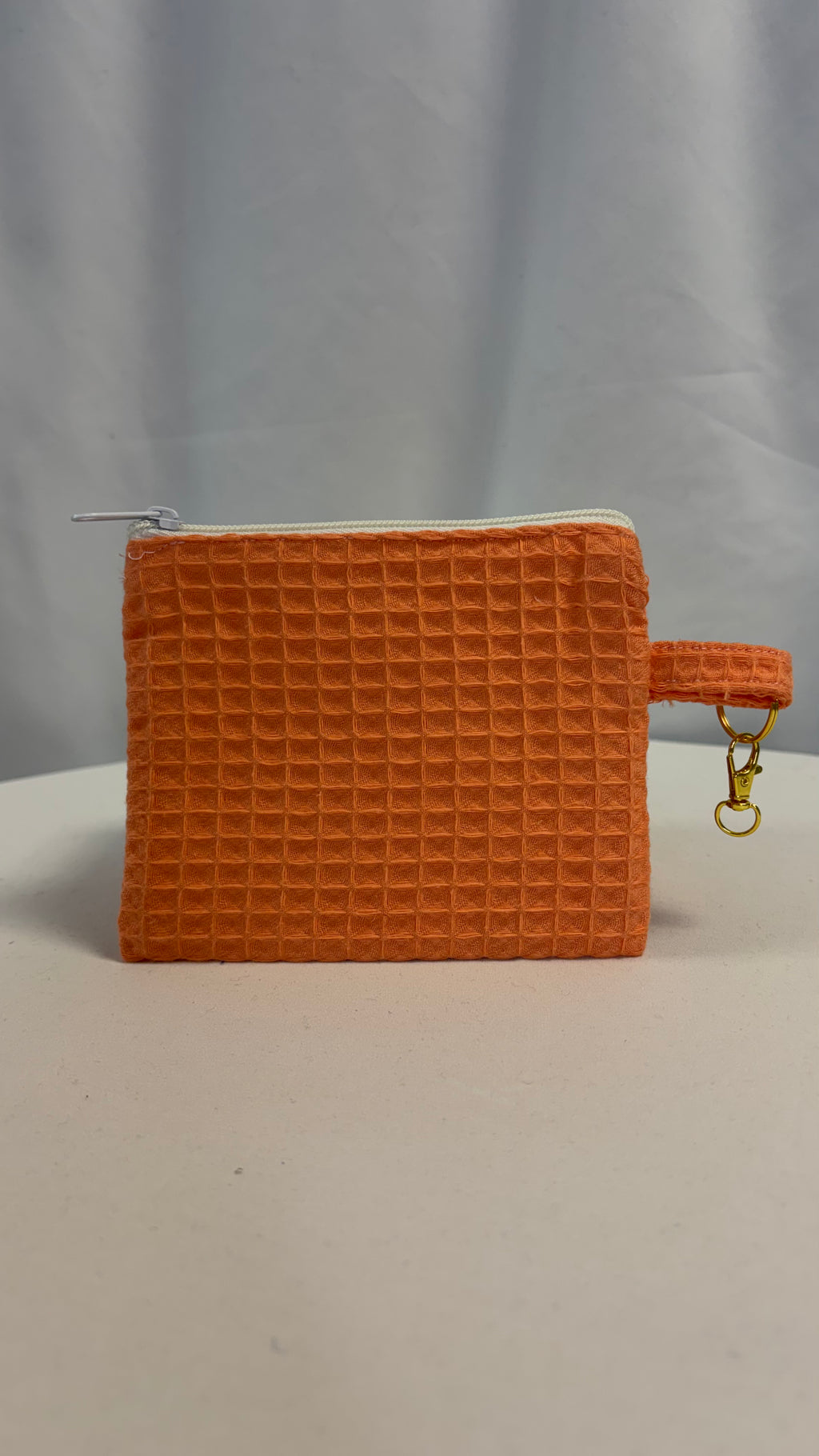 Moyenne pochette nid d’abeille uni papaye