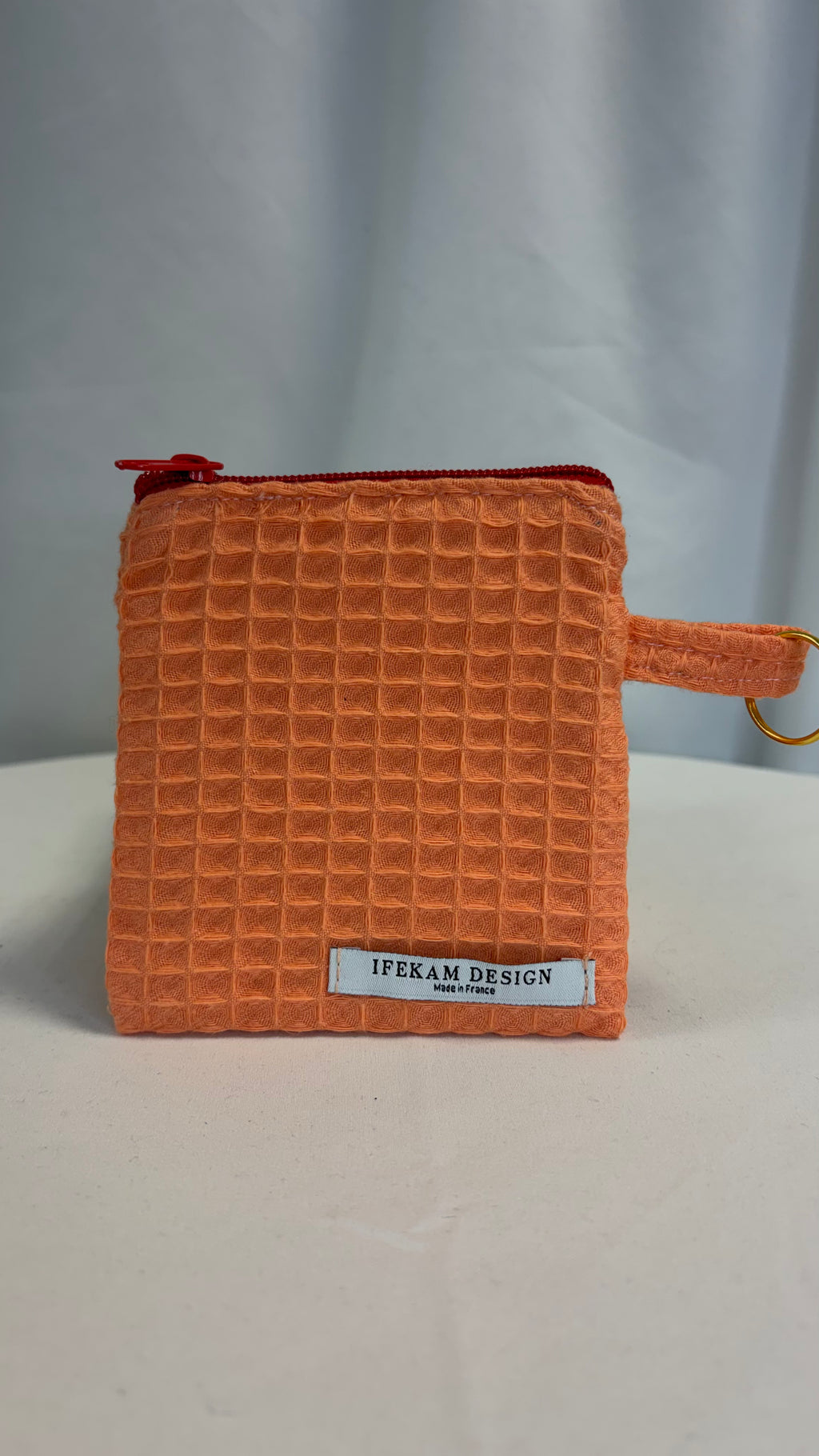 Petite pochette avec tissu nid d’abeille uni papaye
