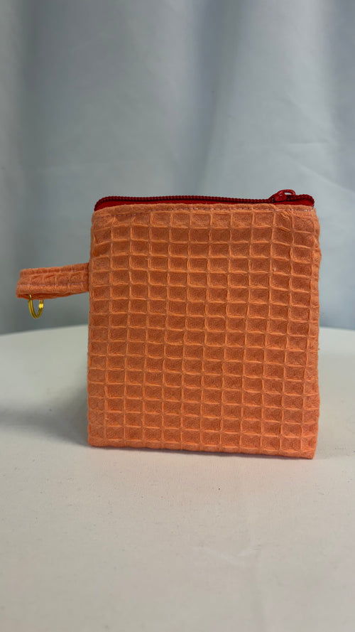 Petite pochette avec tissu nid d’abeille uni papaye